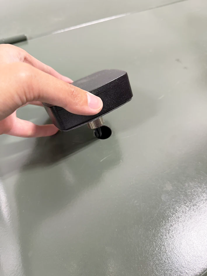 Placing the antenna onto the cabinet hole
