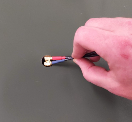 Feeding antenna wires through the cabinet hole